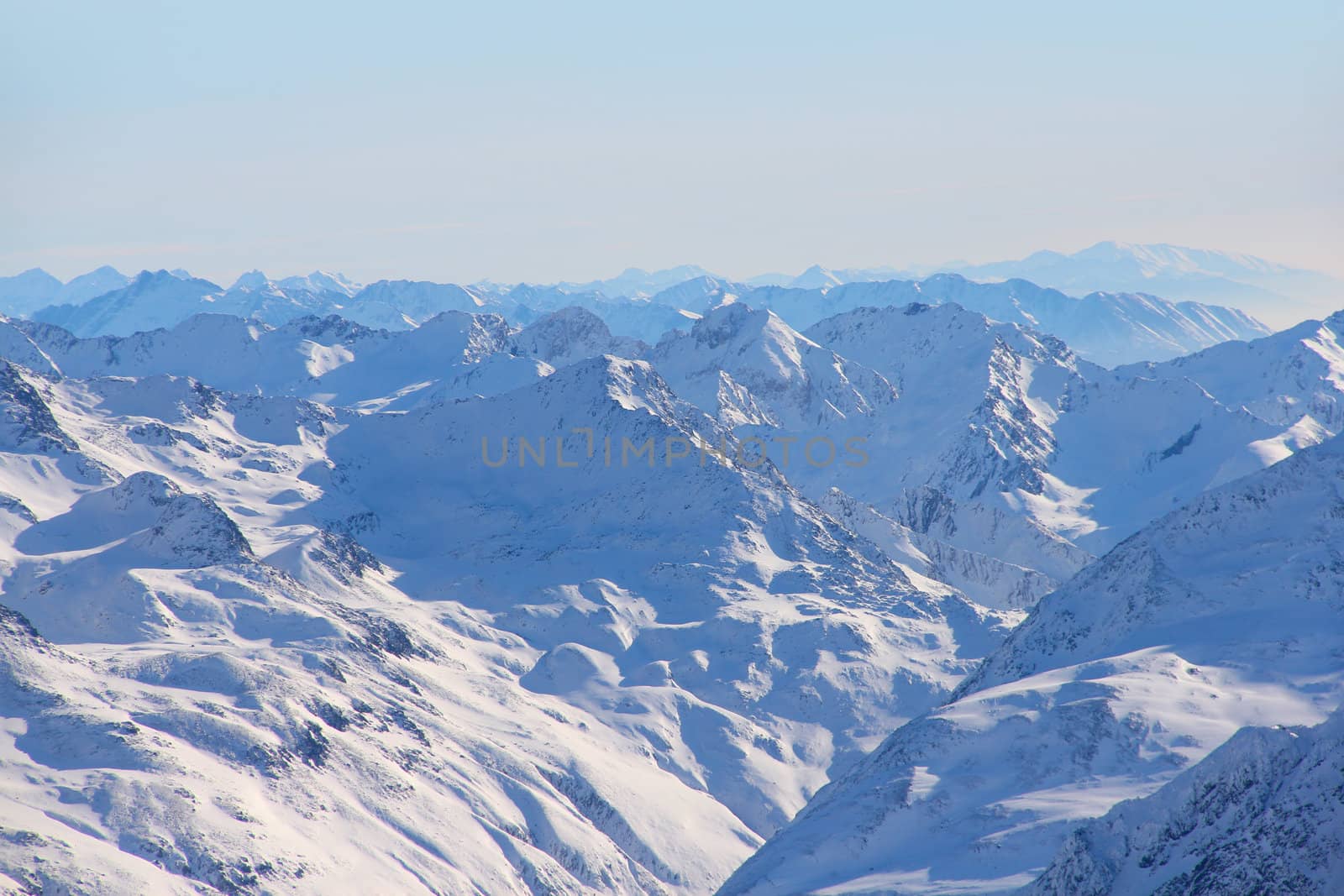 High mountains under blue sky beautiful winter panorama