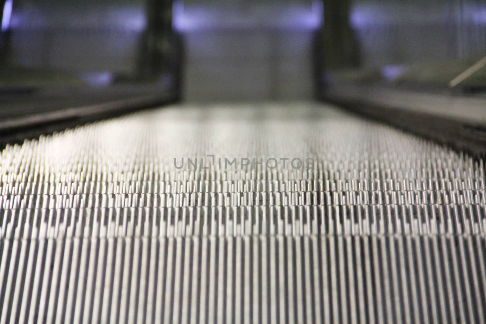 blurry modern escalator steps macro close-up