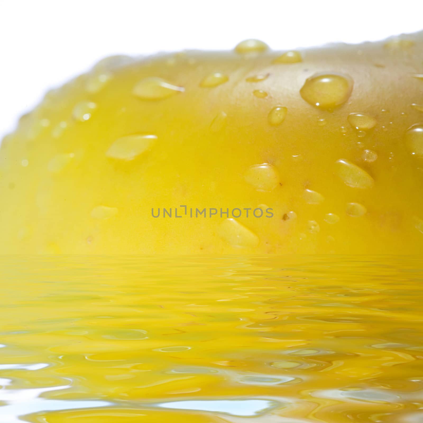 Stock photo: nature theme: an image of water drops on yellow apple