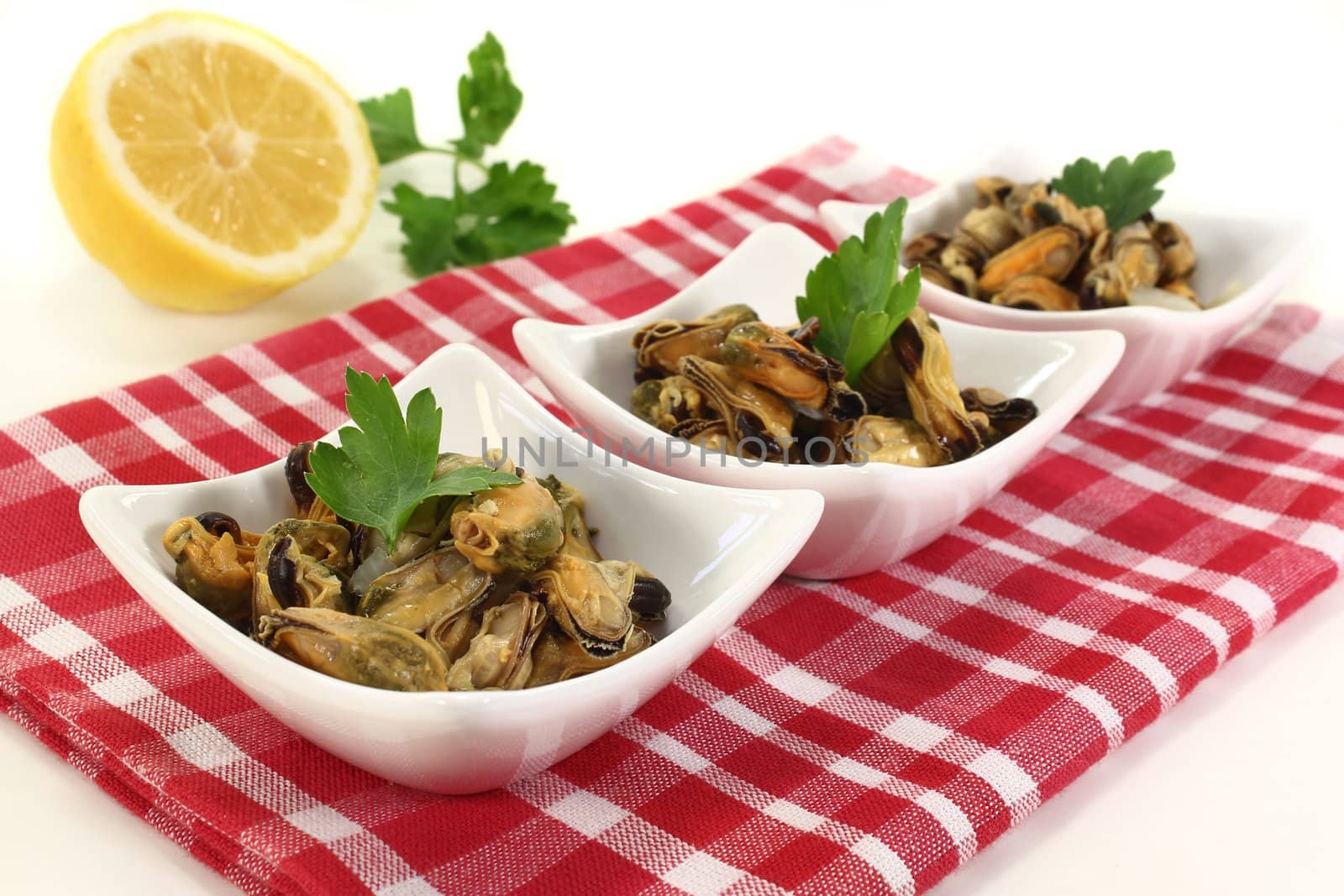 a bowl of marinated mussels and parsley