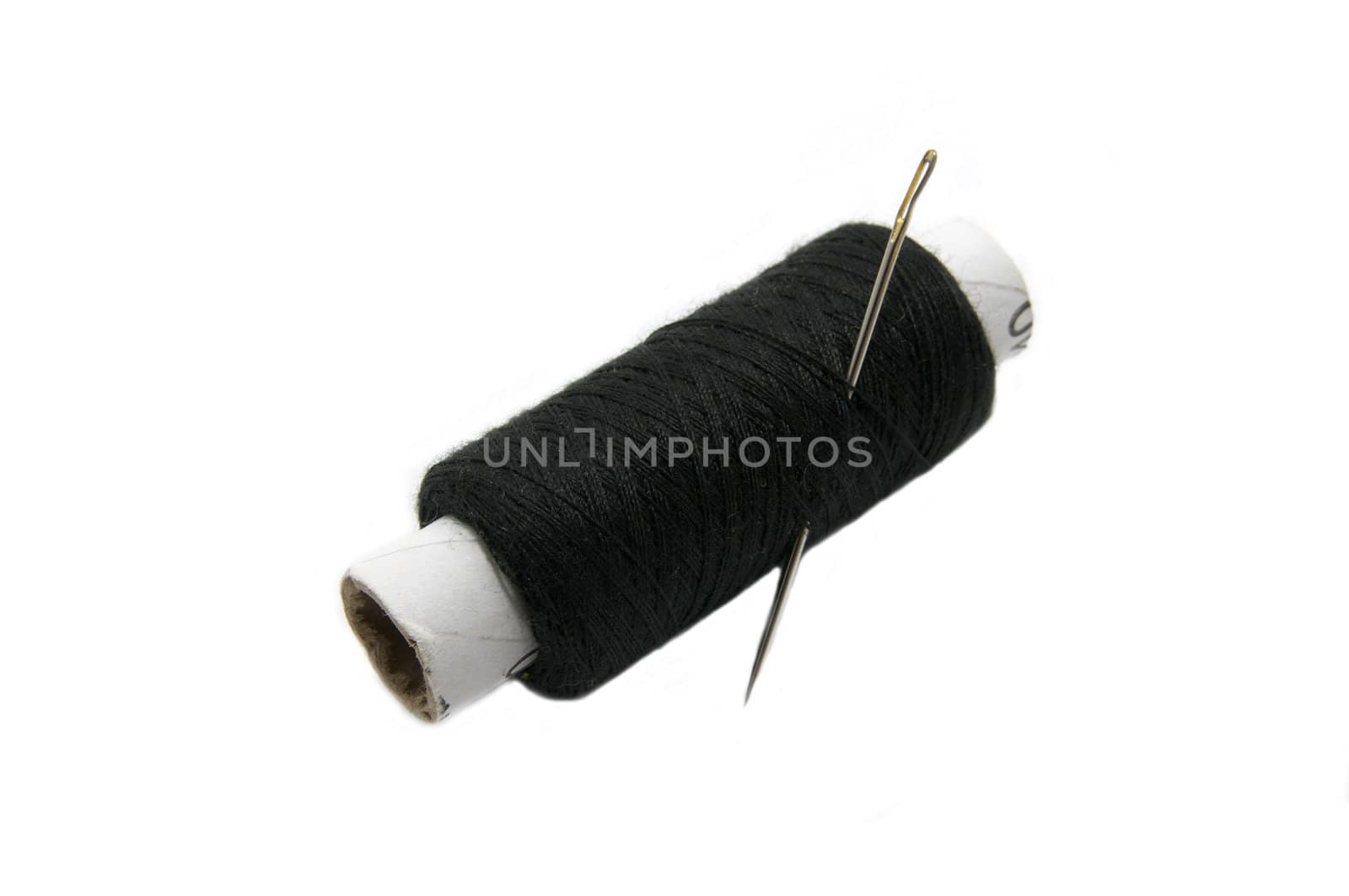 black thread and a needle on a white background