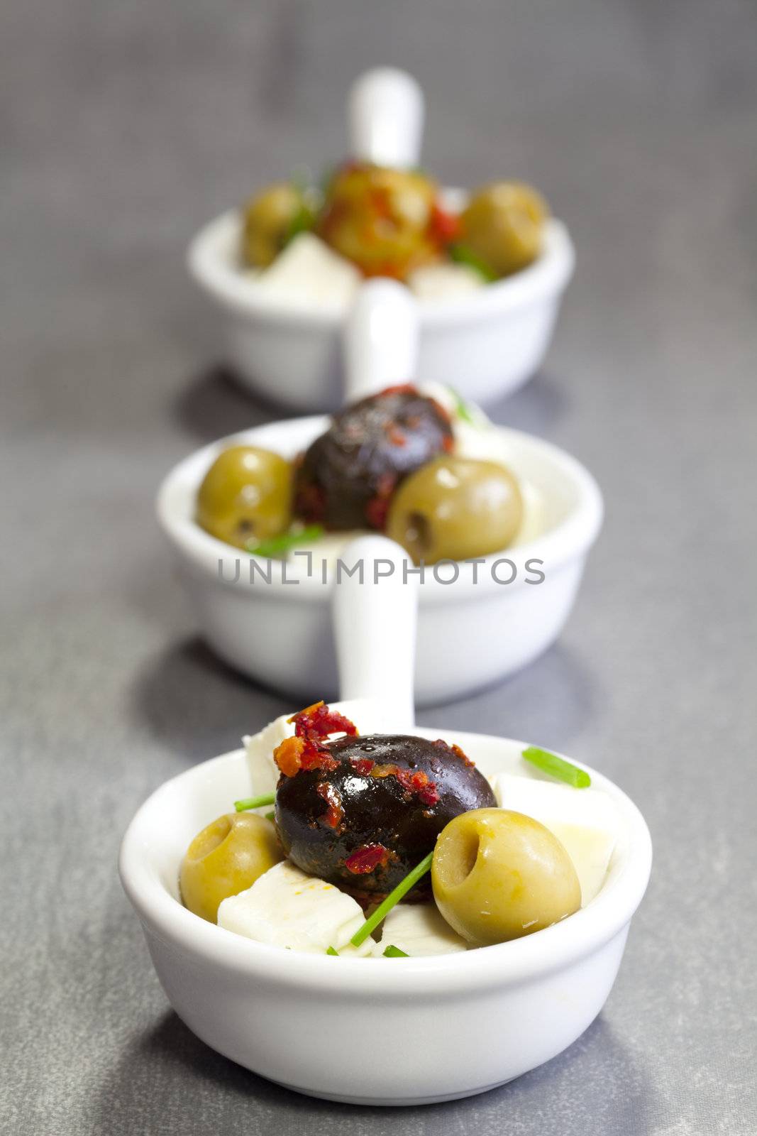 olives with feta cheese in a bowl of porcelain