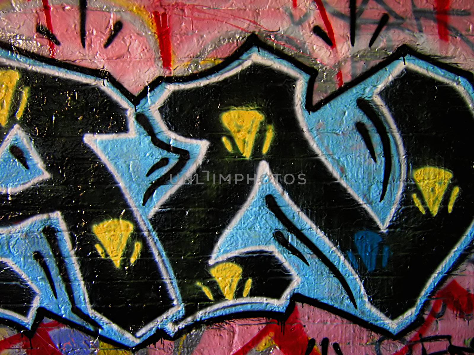 A photograph of graffiti on the side of an abandoned building.