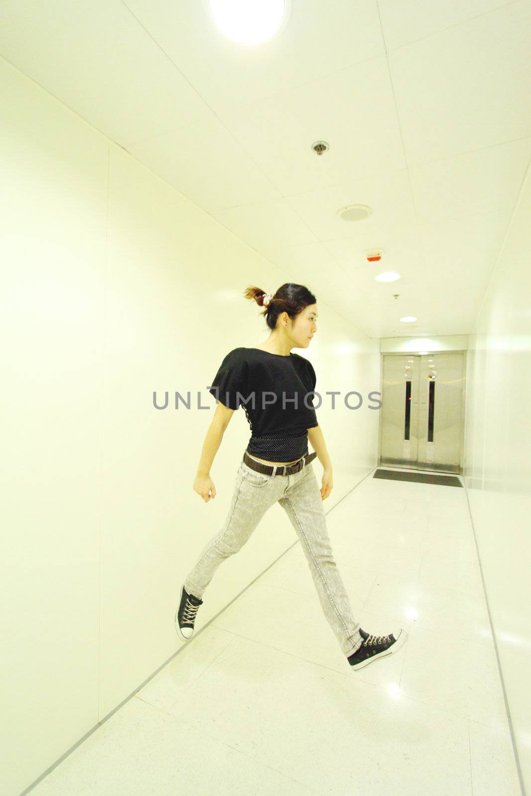 Jumping woman in corridor by kawing921