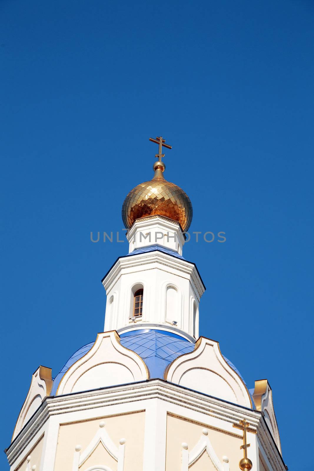 Golden domes of Christian church against the blue sky