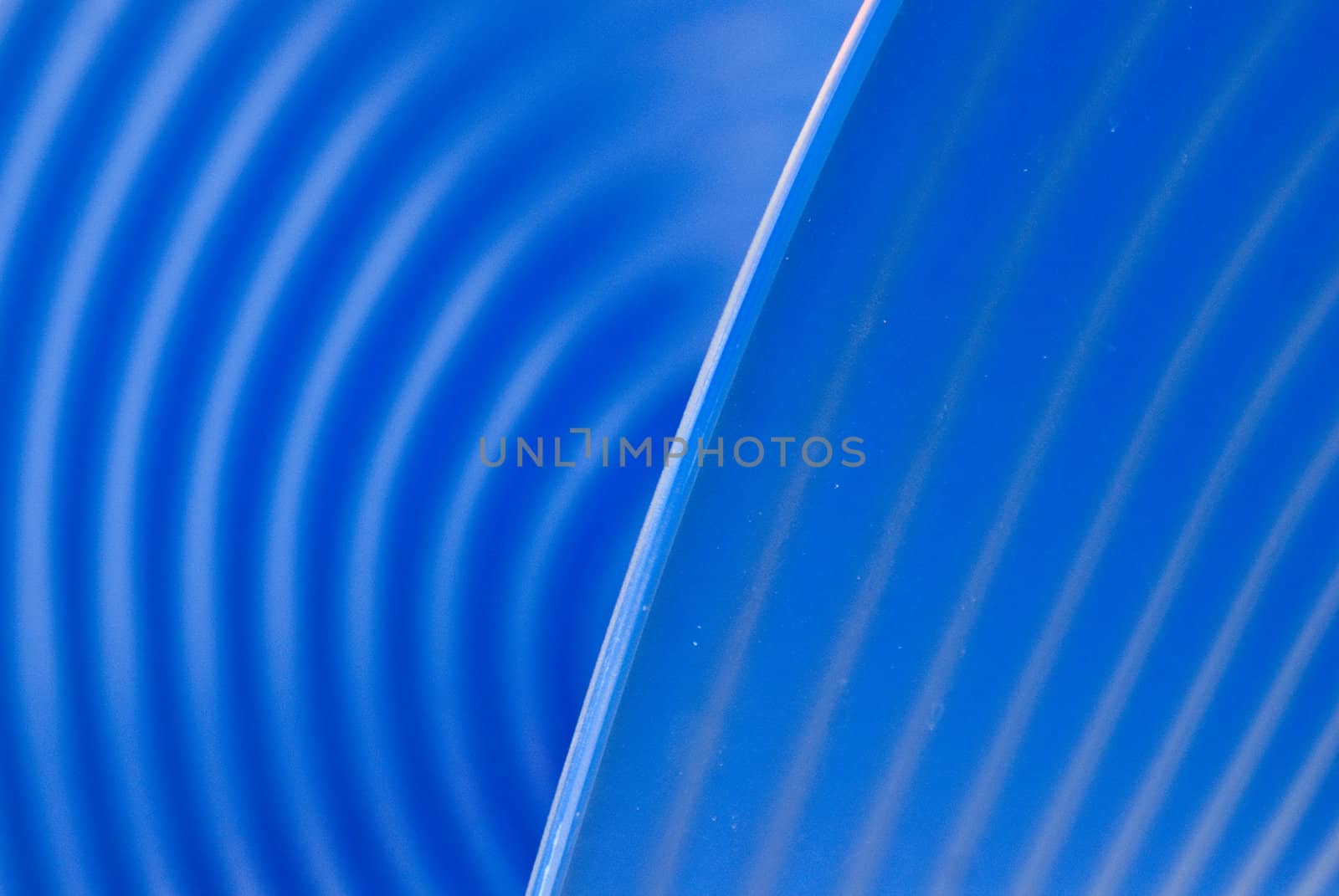 Textured blue plastic chair with swirls
