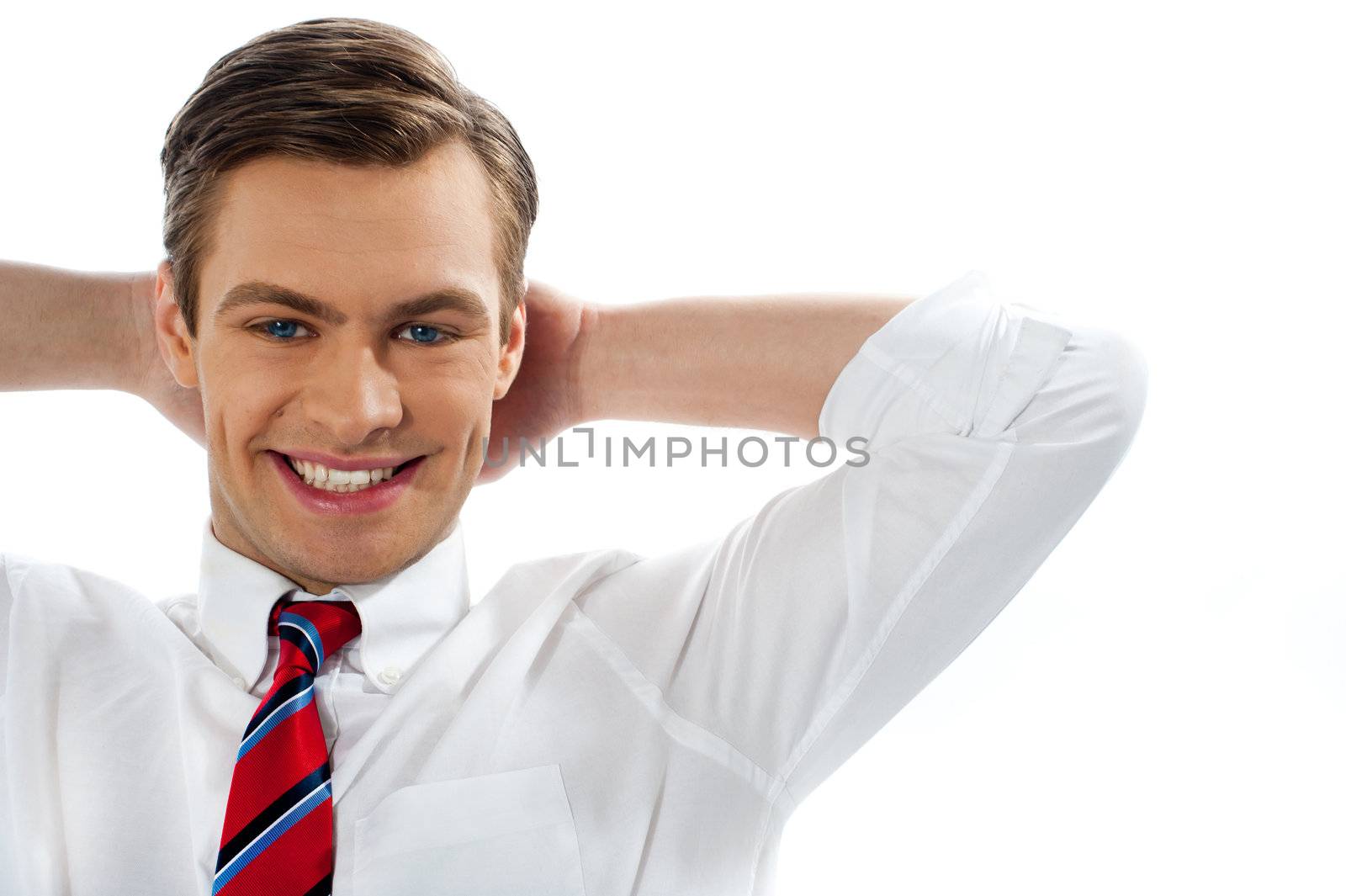 Closeup of relaxed smiling executive by stockyimages