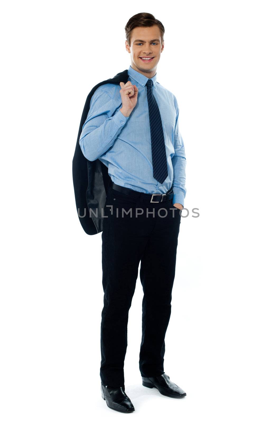 Portait of a professional businessman holding his coat and posing in style