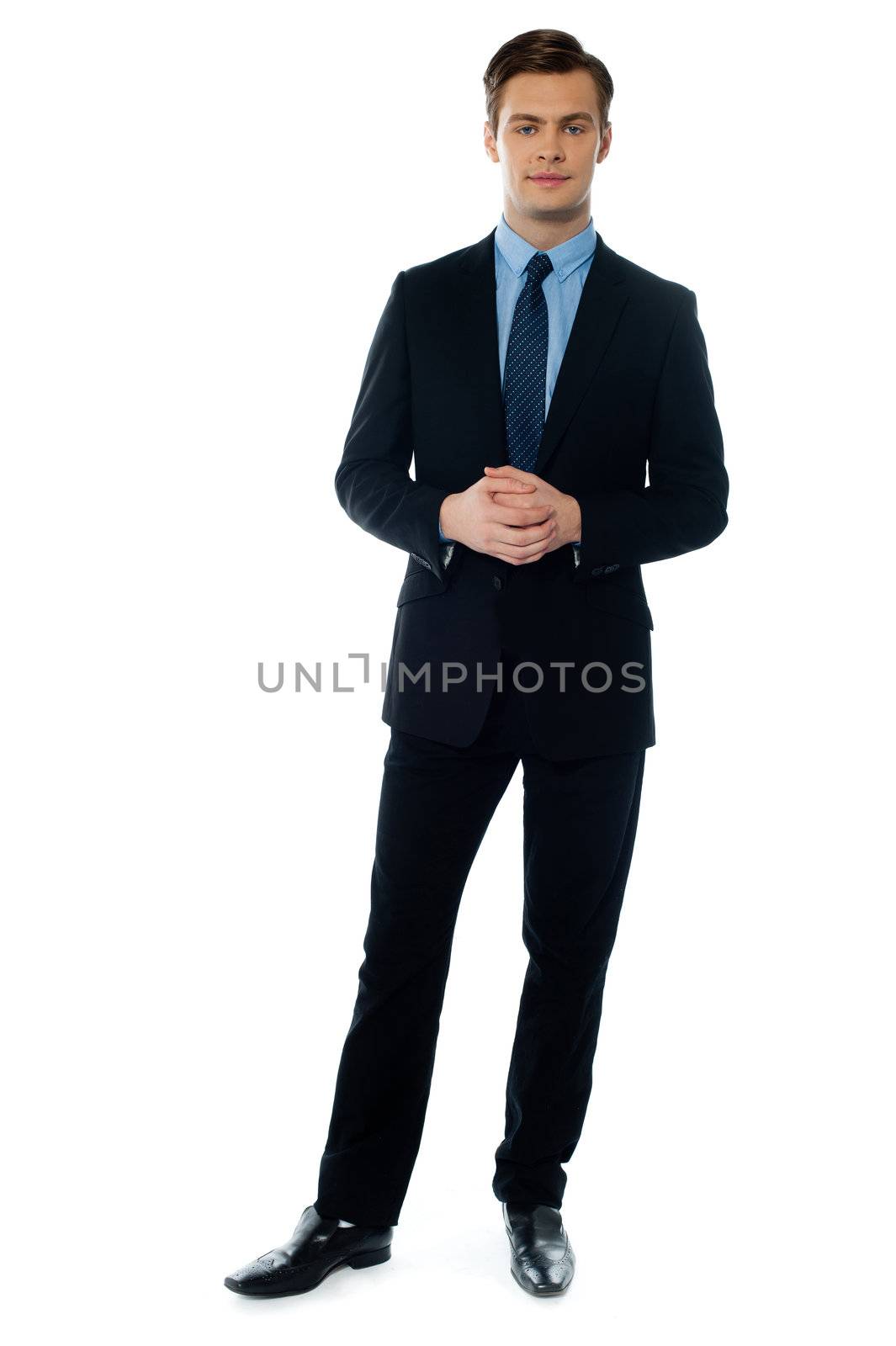 Young handsome man in black suit by stockyimages