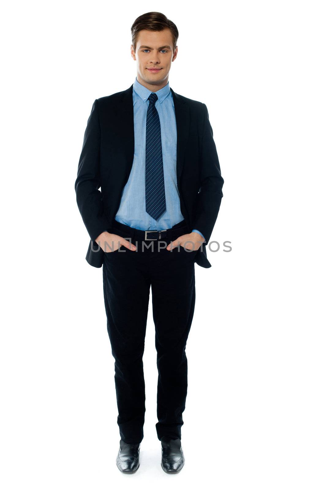 Businessman posing with hands in pocket on white background