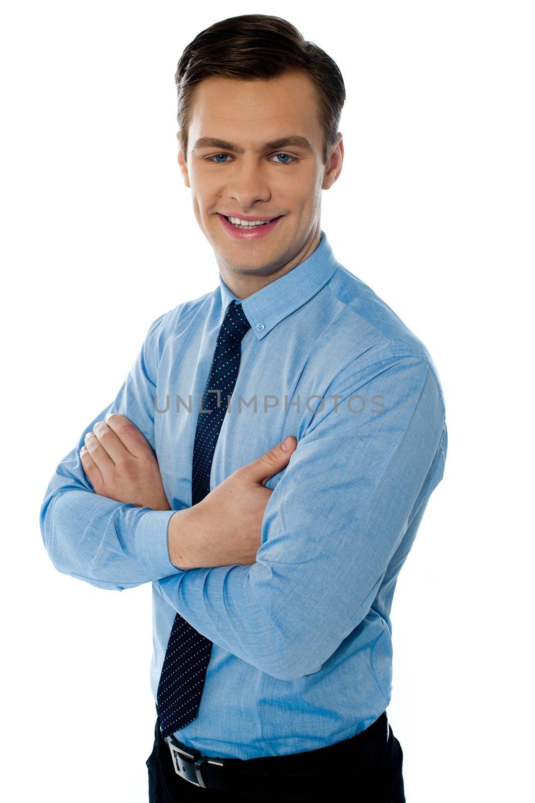 Successful businessman posing with folded arms on white background