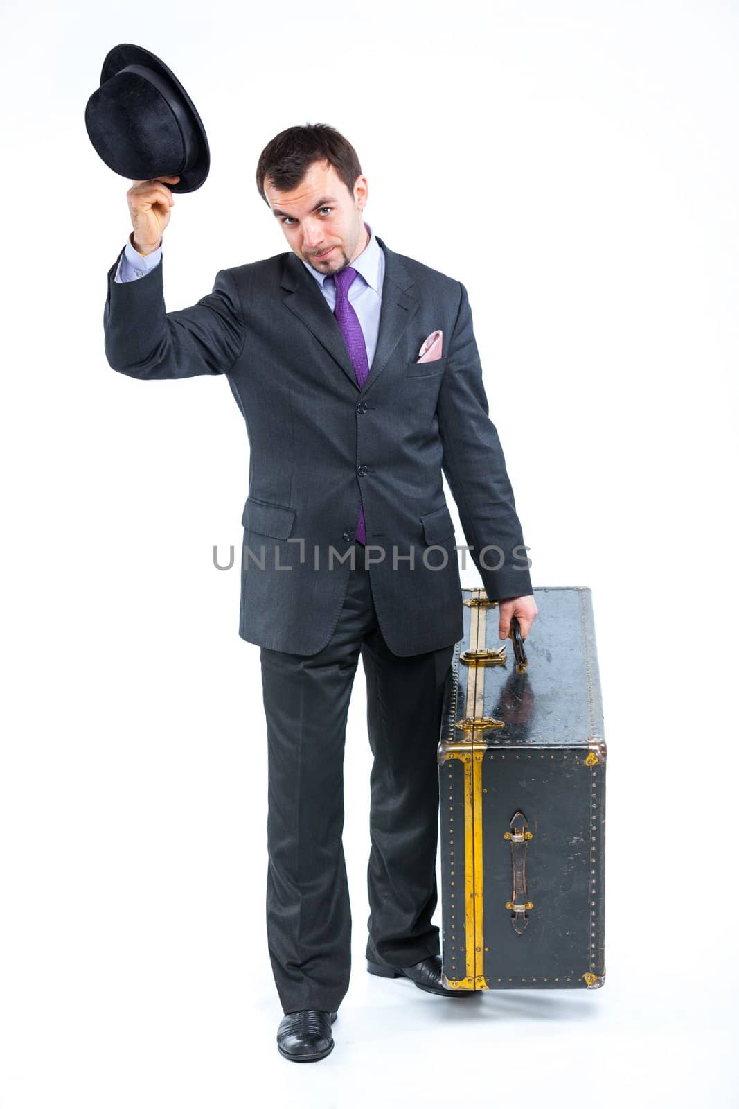 Portrait of a  business man with big old suitcase isolated on white background. Studio shot.