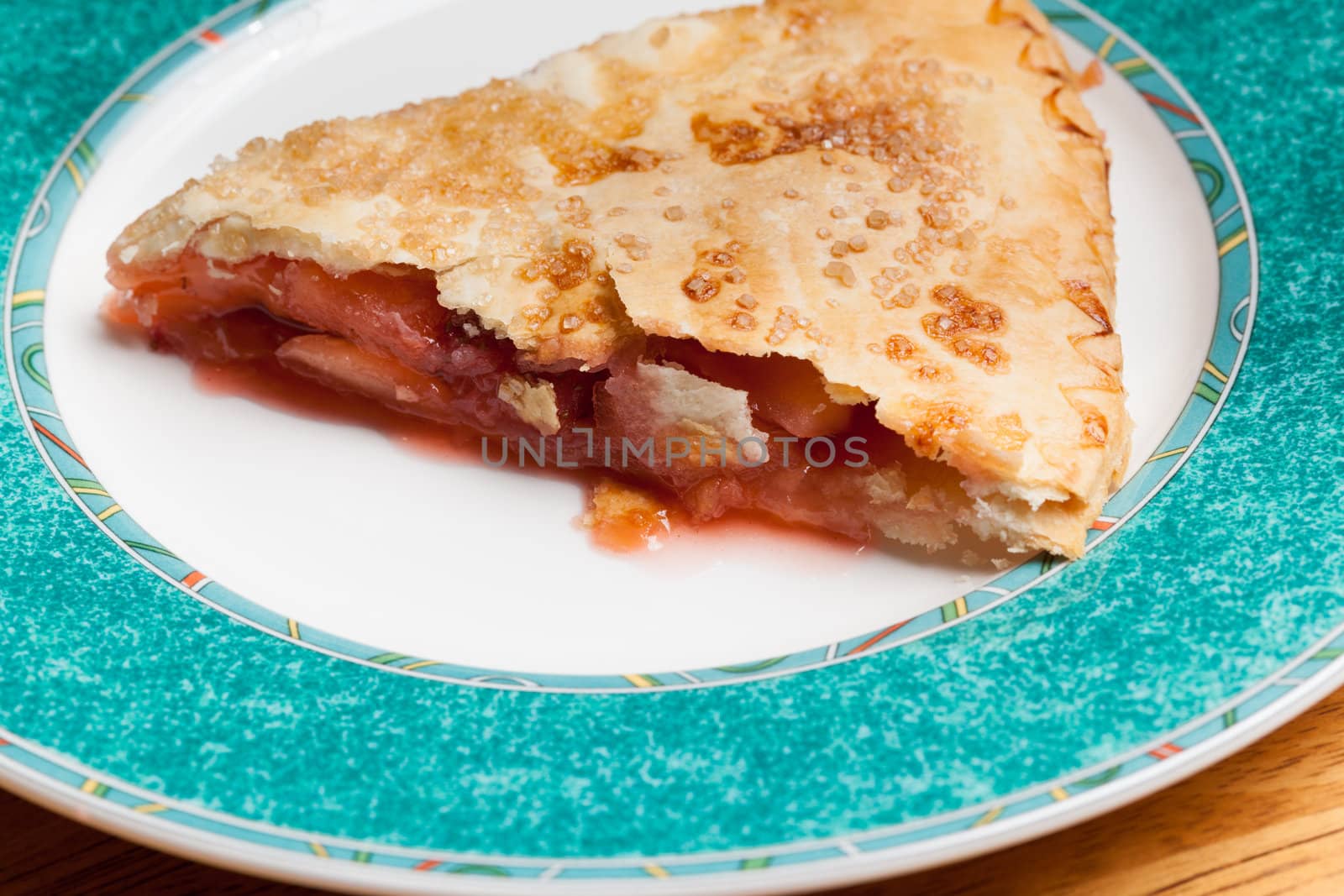 Home made baked fruit pie on plate in single serving