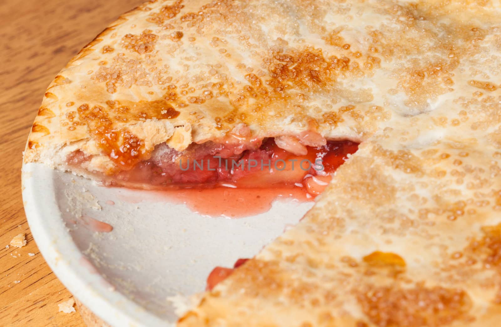 Home made baked fruit pie from oven with a missing piece