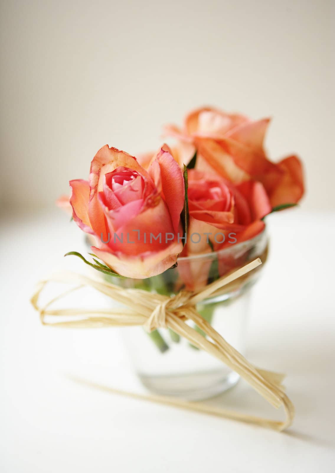 a wedding composition of roses in a glass