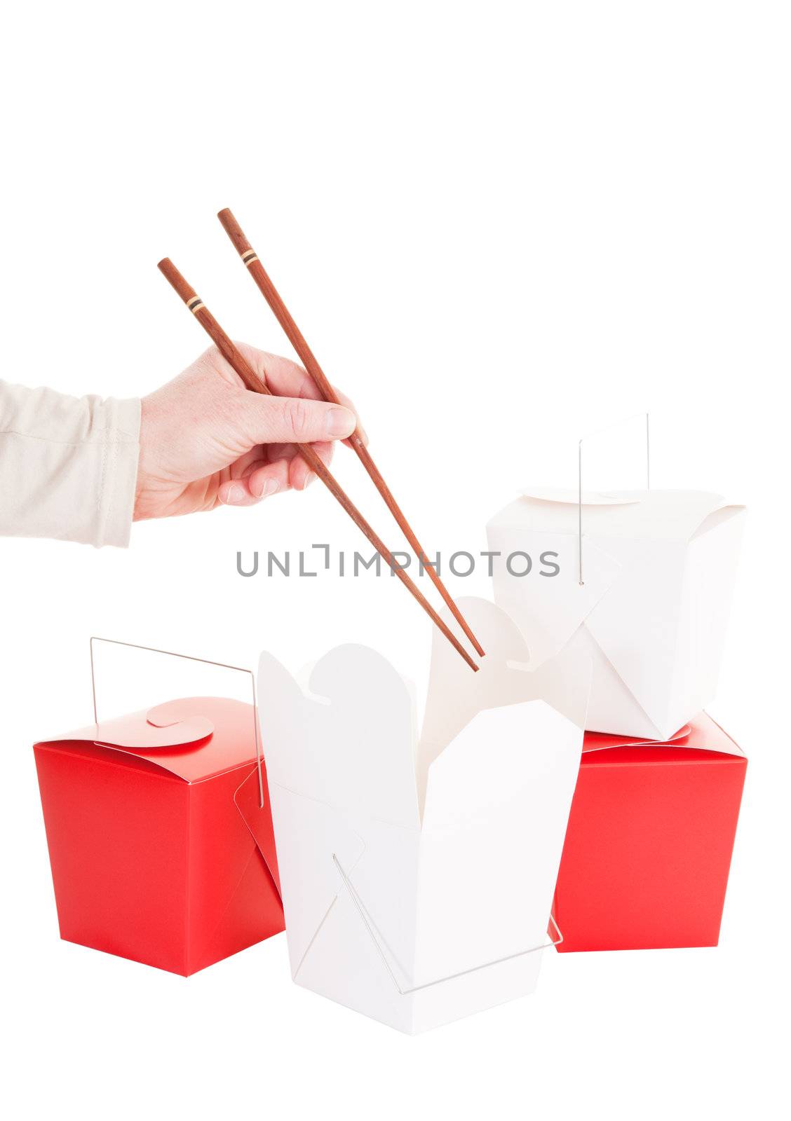 A hand with chopsticks about to dig into some Chinese take-out food.