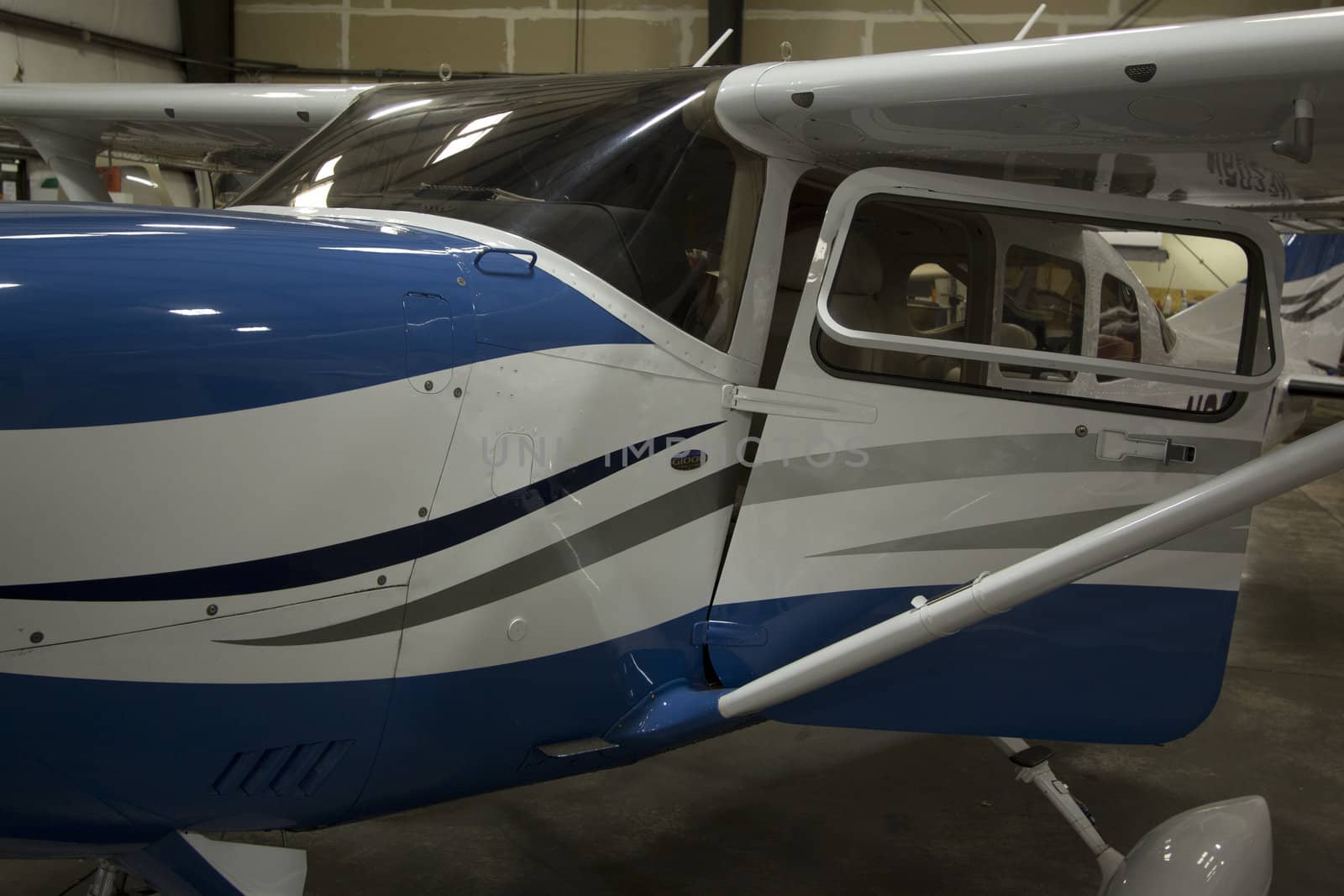 Small airplanes in the shop at an airport.