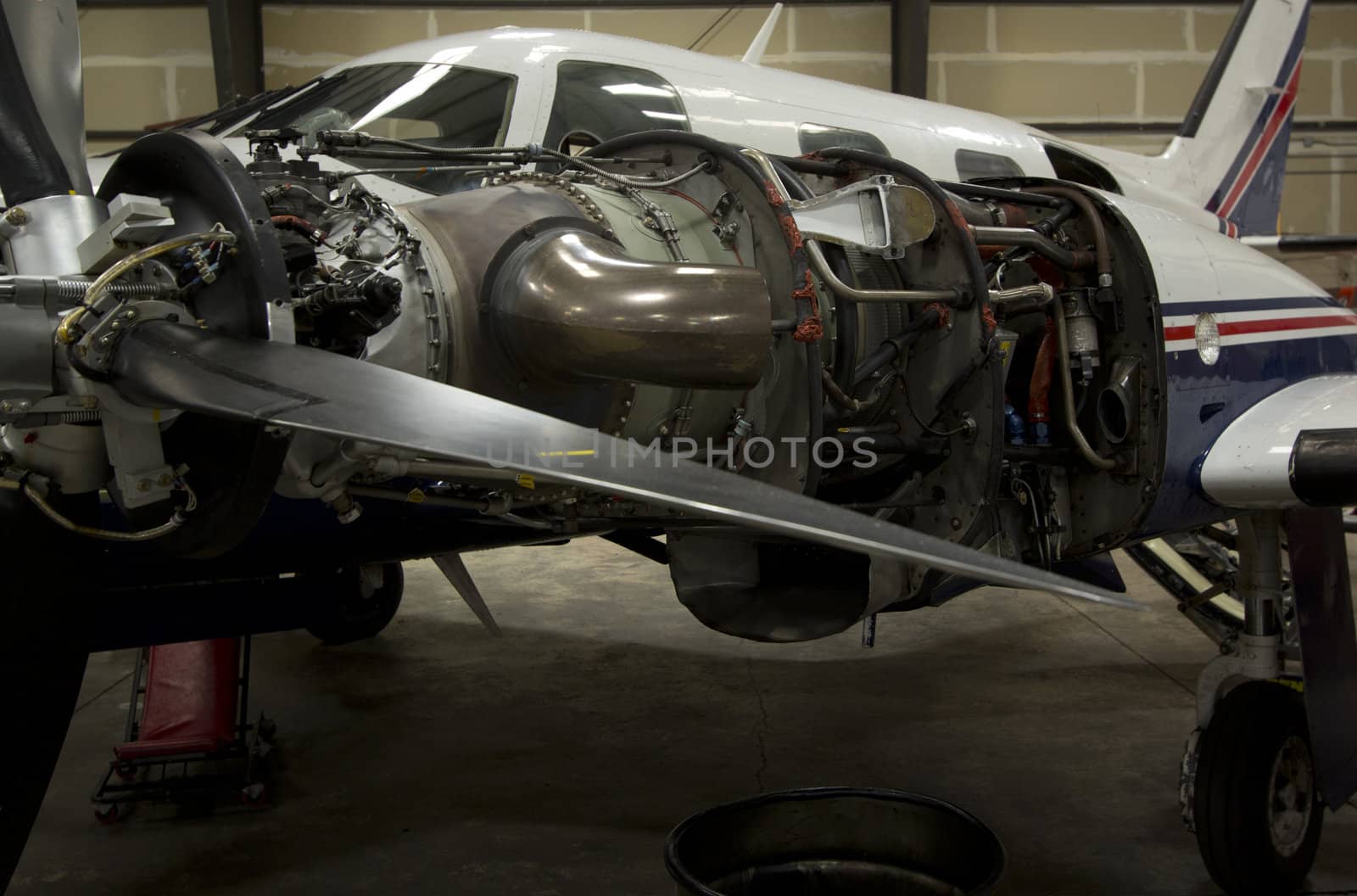 Small airplanes in the shop at an airport.