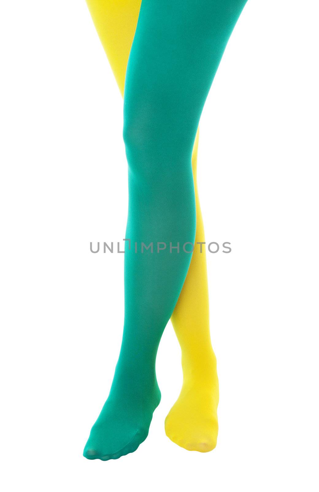 A girl showing team  or school spirit by wearing a green and a yellow stocking.  Shot on white background. 