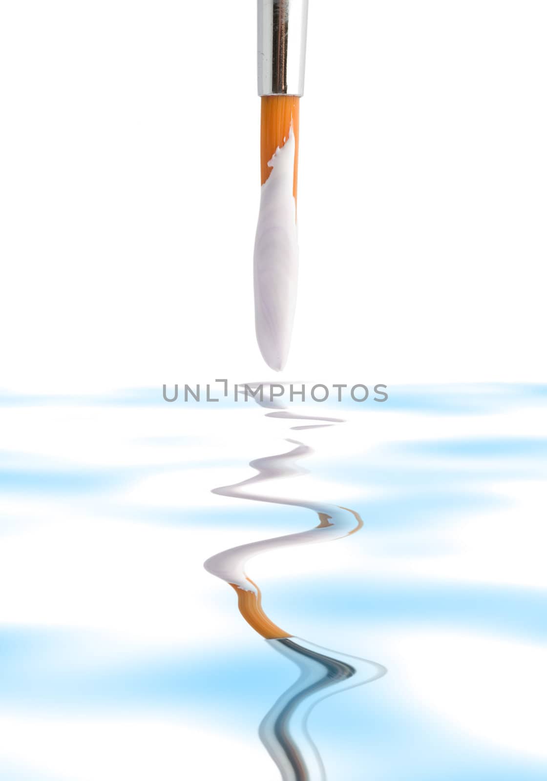 Stock photo: an image of a brush with white paint on it