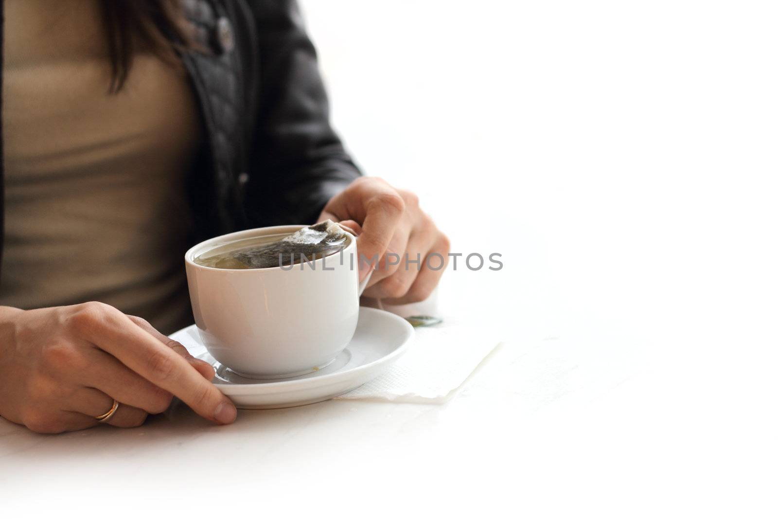 Woman brew tea from teabag isolated on white