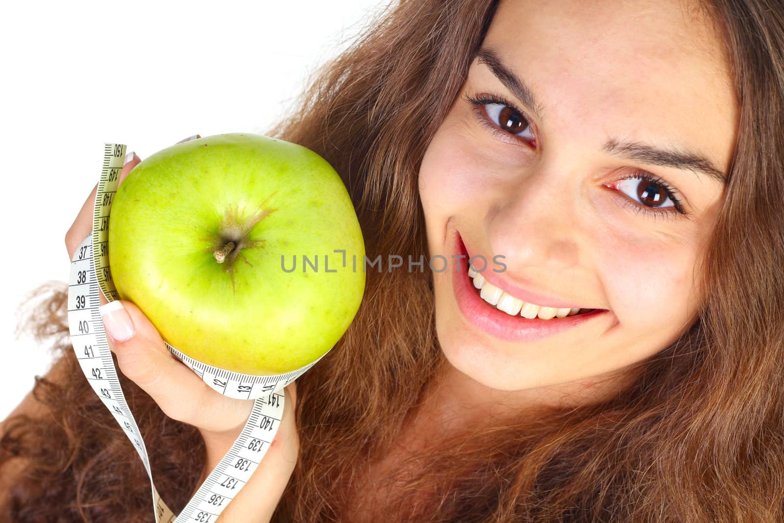 Woman with apple and centimeter closeup on white