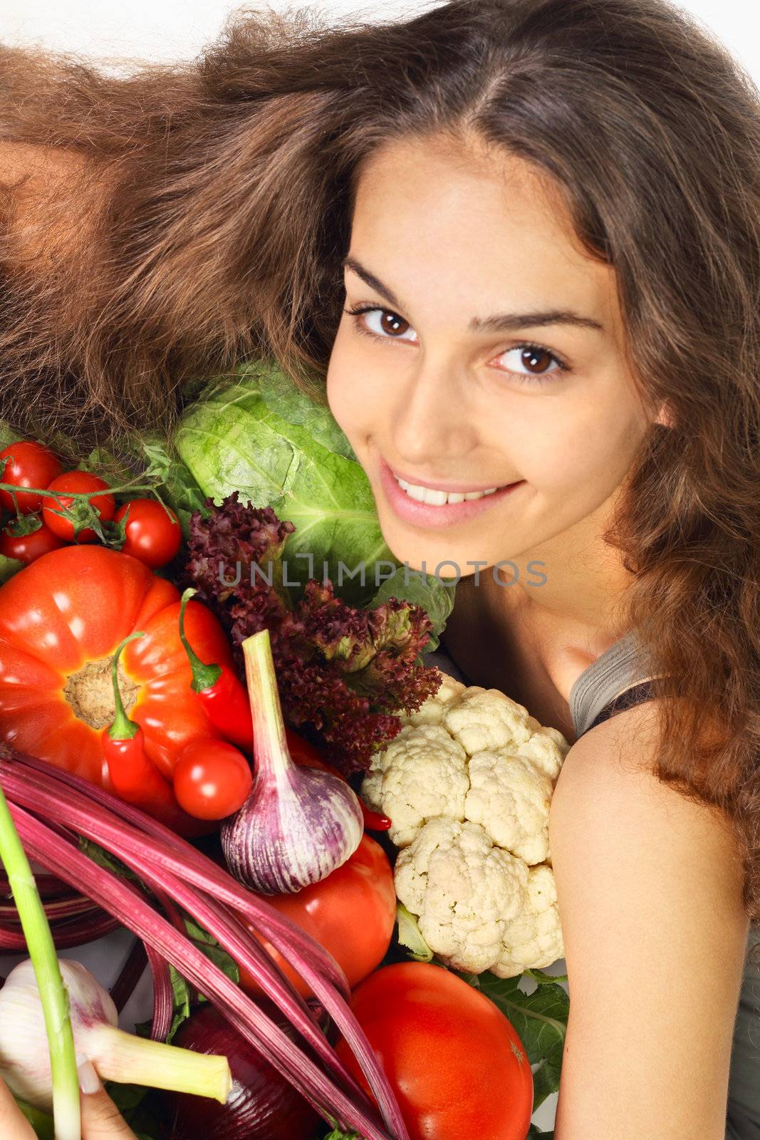 Woman with various vegetables, close-up portrait