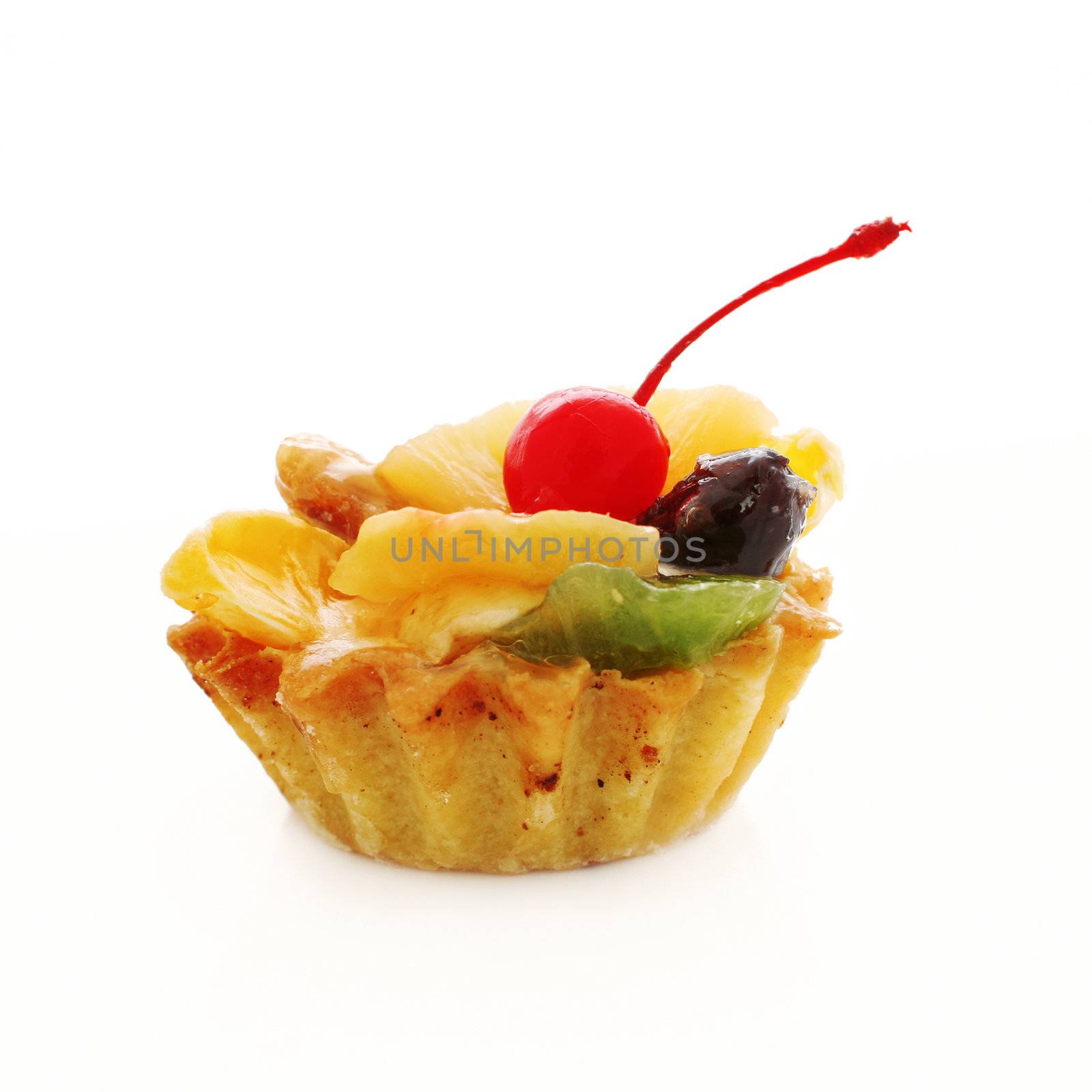 An image of a cake with berry on top. On white background.
