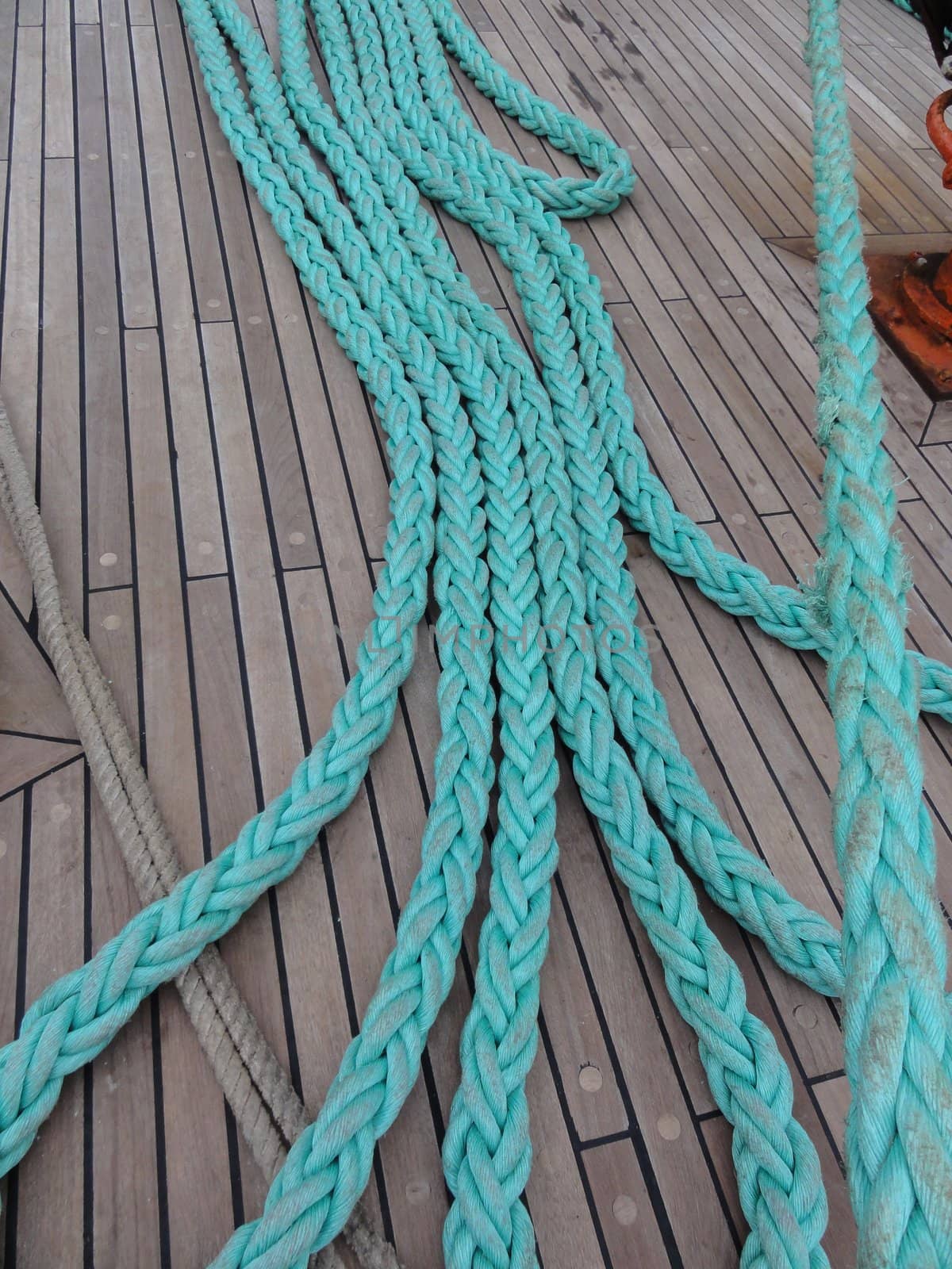 photo of green ship mooring rope on deck