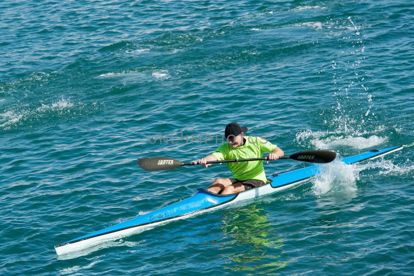 LAS PALMAS, SPAIN – MARCH 10: Unidentified man from club amigos del piraguismo in Canary Islands, kayaking during Boat and Marine Expo FIMAR 2012 on March 10, 2012 in Las Palmas, Spain
