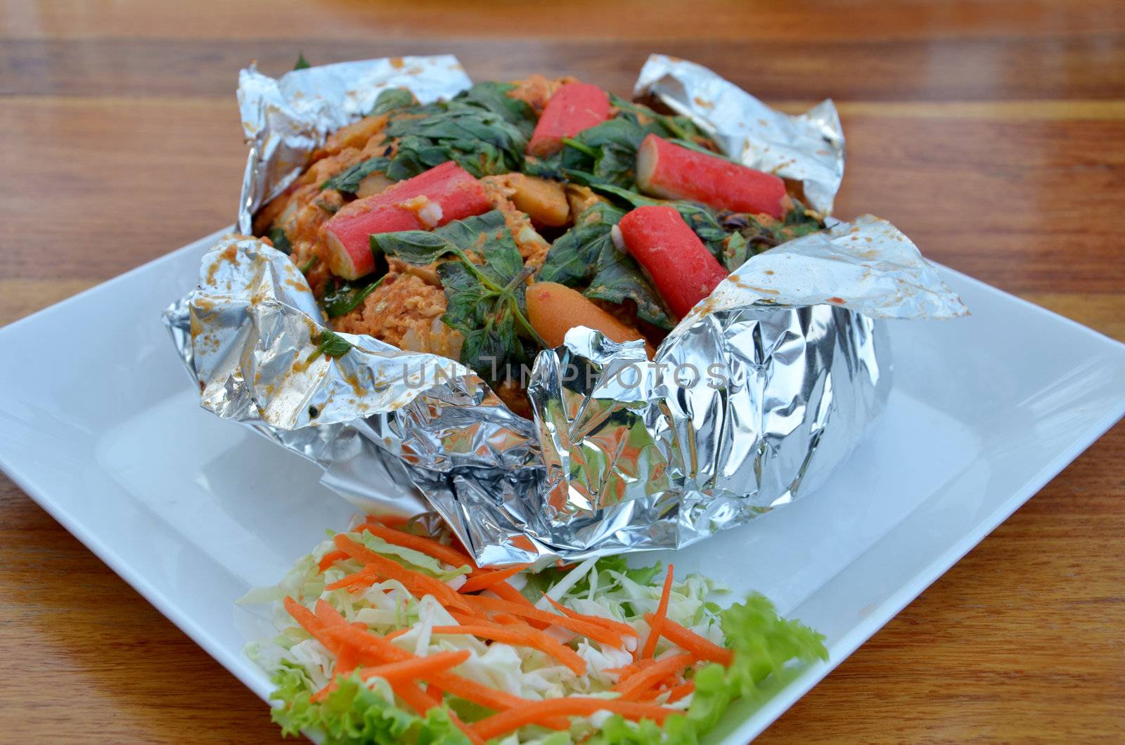 Ho Mok Thale  is Thai food , curry seafood mixed herb served with vegetable