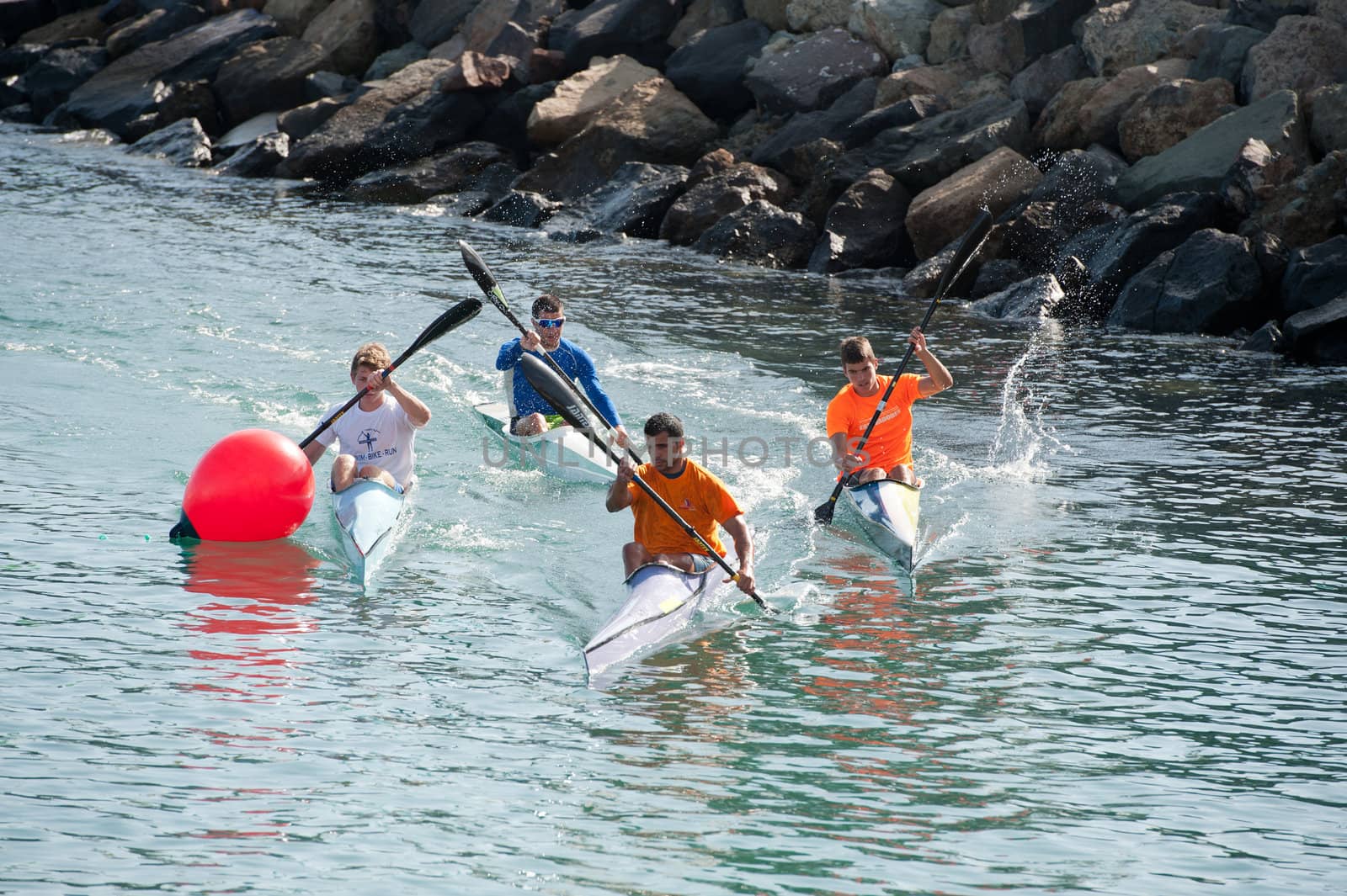 LAS PALMAS, SPAIN – MARCH 11: Unidentified men from club amigos del piraguismo in Canary Islands, kayaking during Boat and Marine Expo FIMAR 2012 on March 11, 2012 in Las Palmas, Spain
