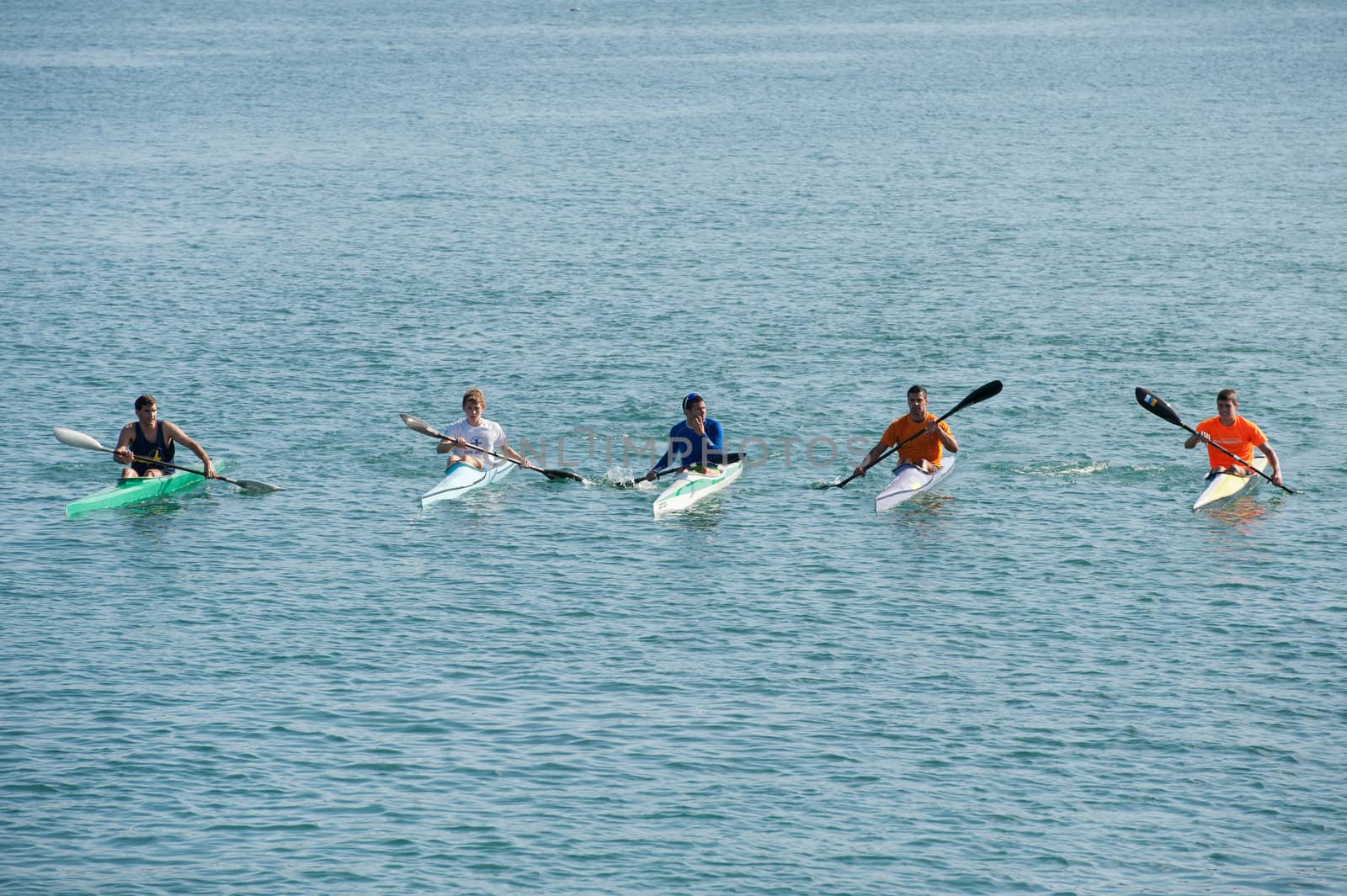 LAS PALMAS, SPAIN – MARCH 11: Unidentified men from club amigos del piraguismo in Canary Islands, kayaking during Boat and Marine Expo FIMAR 2012 on March 11, 2012 in Las Palmas, Spain
