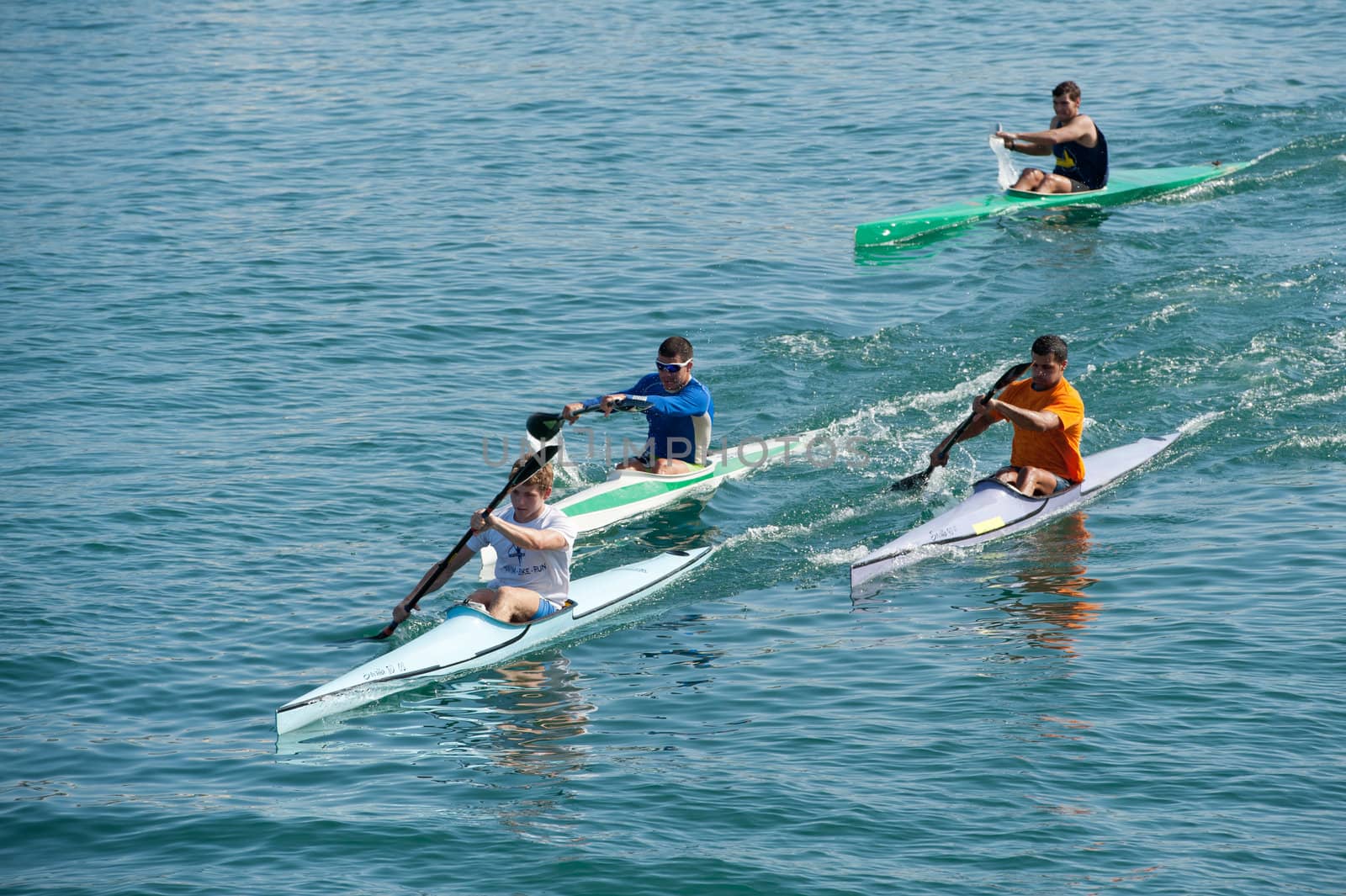 LAS PALMAS, SPAIN – MARCH 11: Unidentified men from club amigos del piraguismo in Canary Islands, kayaking during Boat and Marine Expo FIMAR 2012 on March 11, 2012 in Las Palmas, Spain
