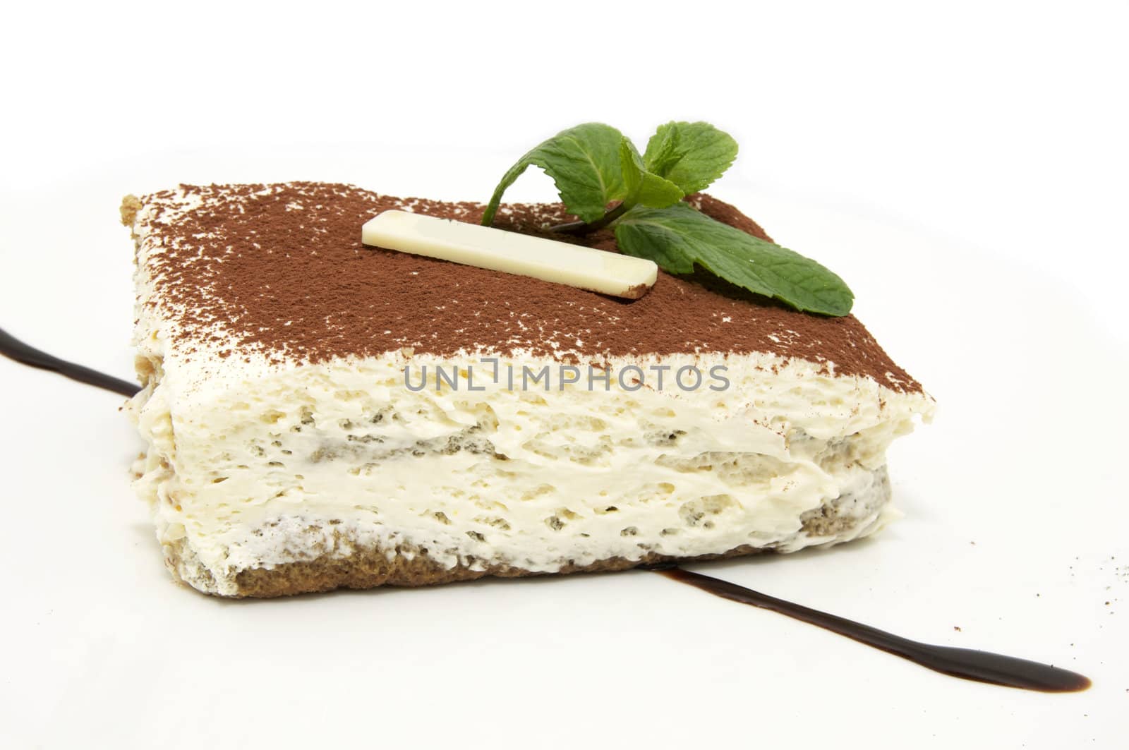 piece of cake decorated with cream and chocolate mint