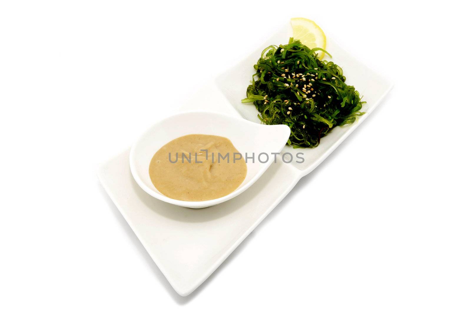 cabbage salad with dressing on a white background