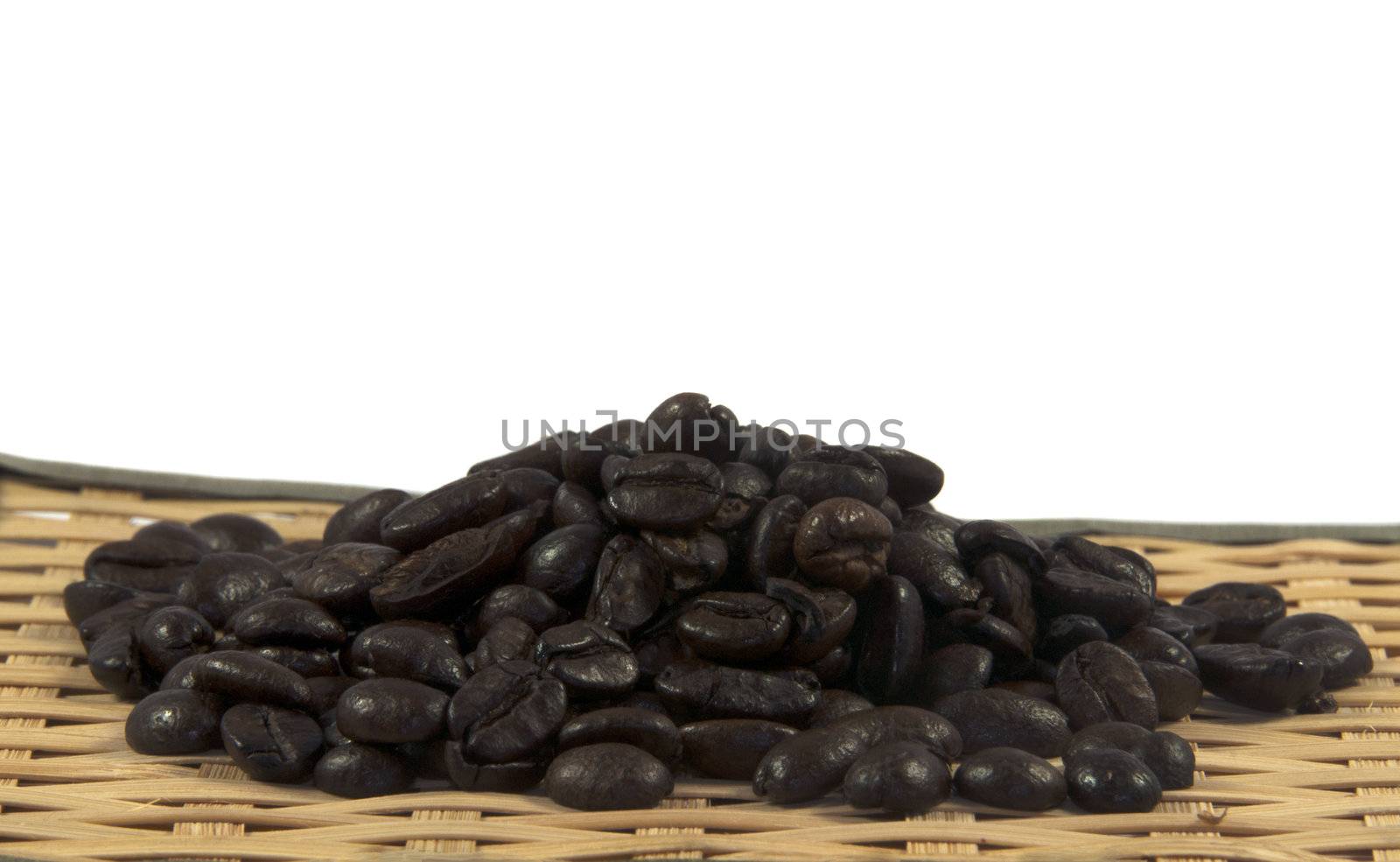 coffe beans on bamboo plate and white background