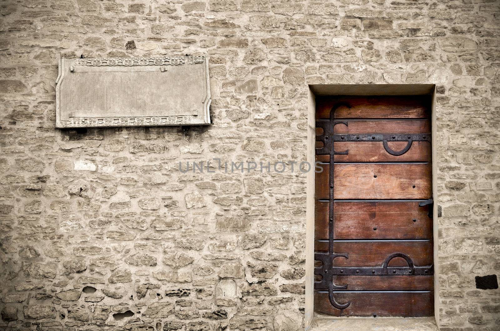 Wood door on stone wall by silent47