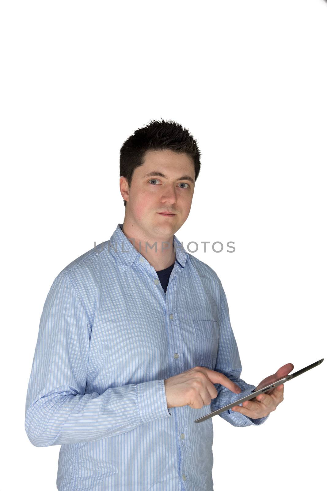 A picture of a man touching a tablet and looking in the cameras direction