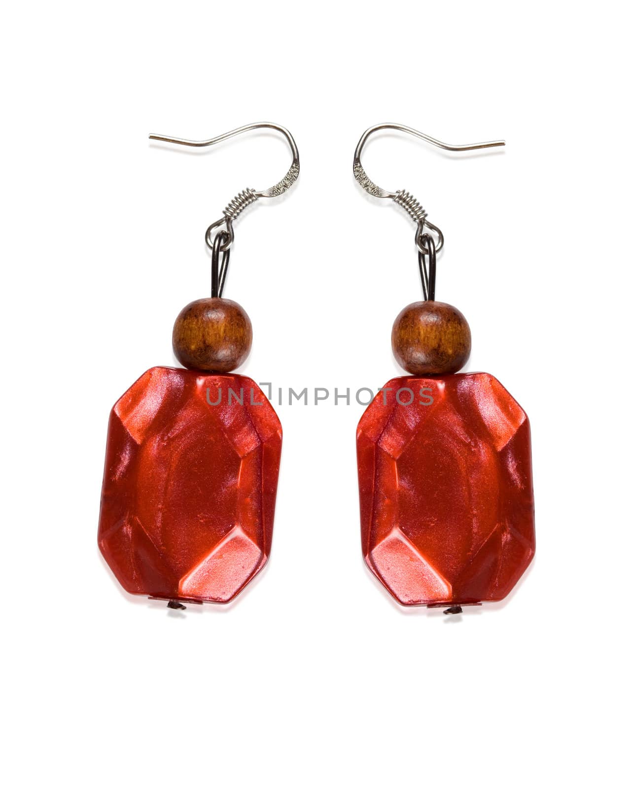 Earrings garnet color of glass and wood isolated on a white background. Collage.