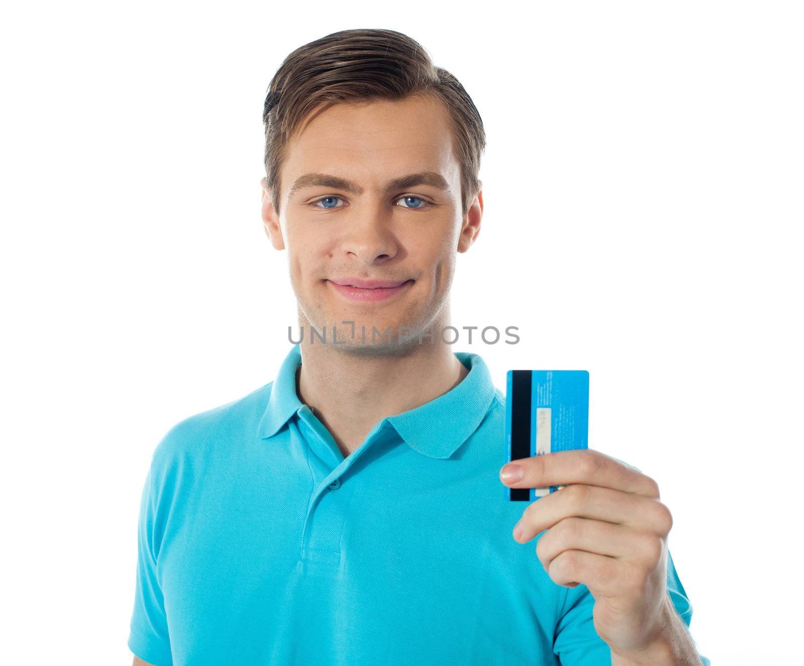 Close-up of handsome guy holding a credit card by stockyimages