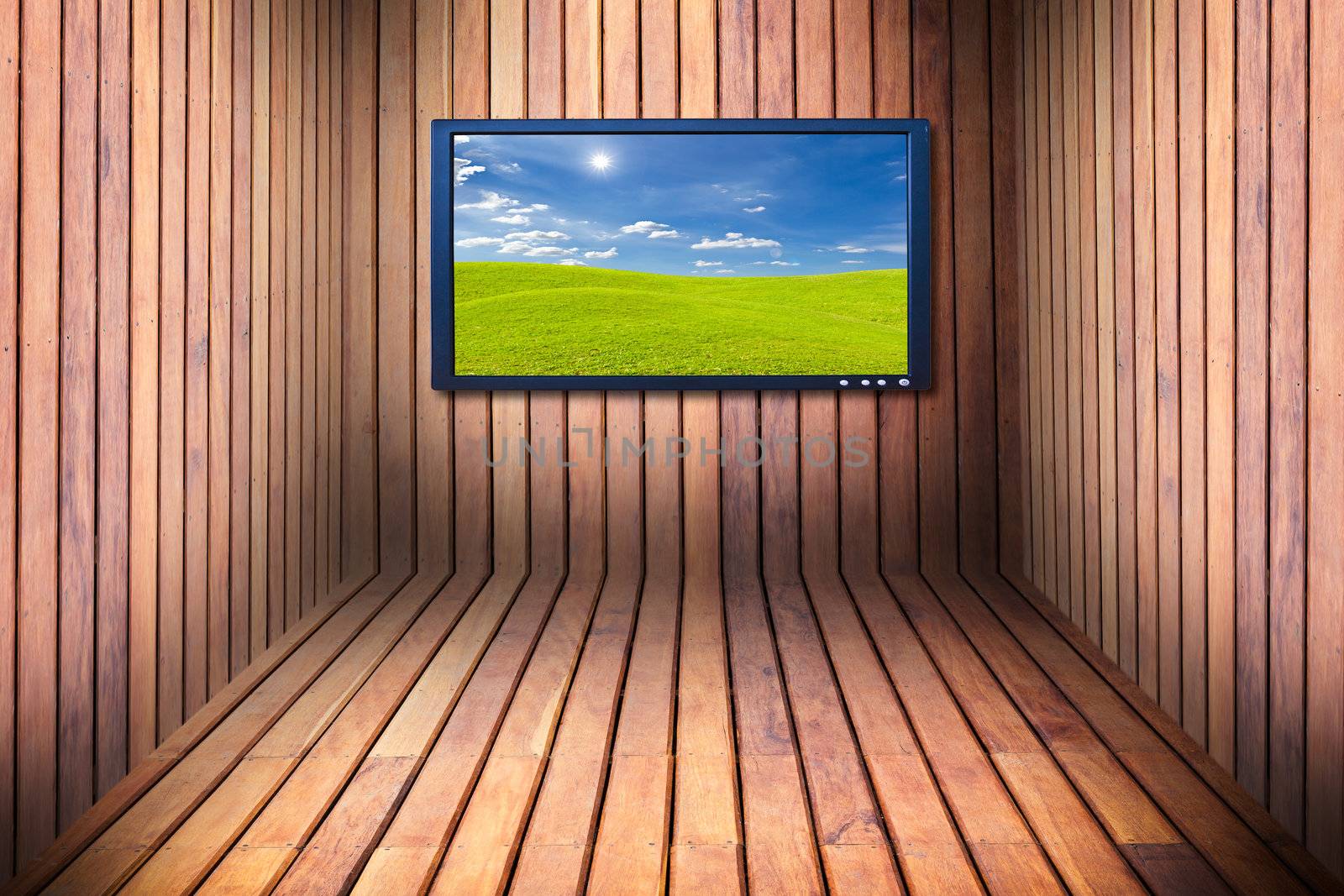 wide screen television in wooden room by tungphoto