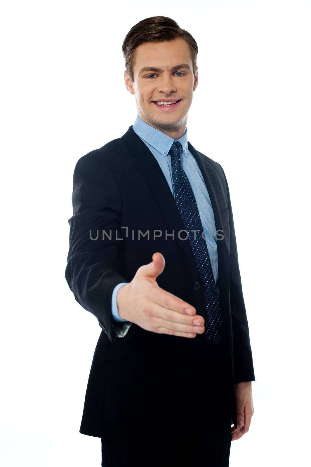 Successful young businessman offering handshake