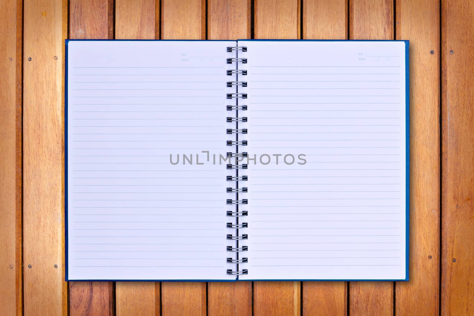 blue notebook on wood background