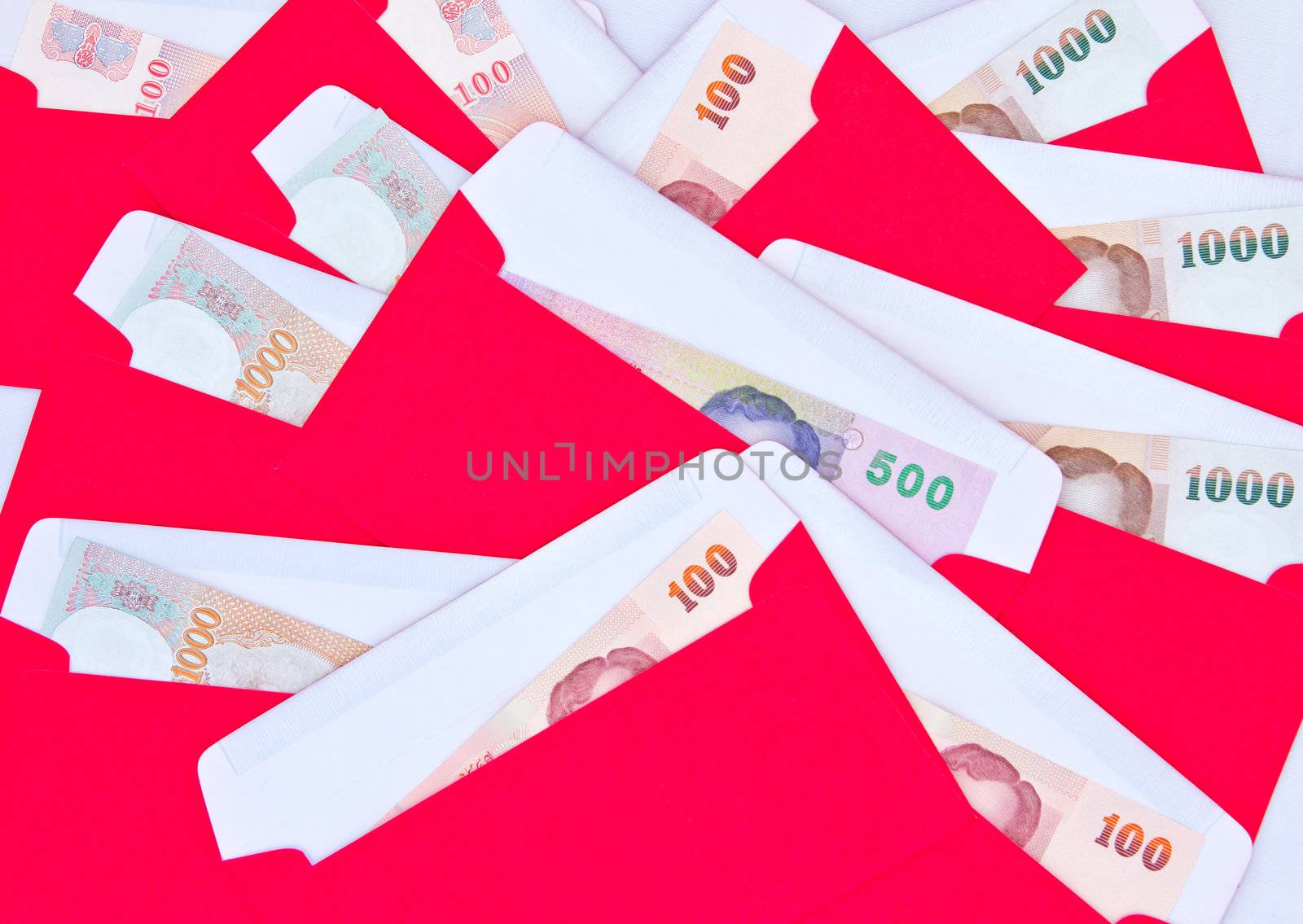 money in red envelope for give to people on chinese new year by tungphoto