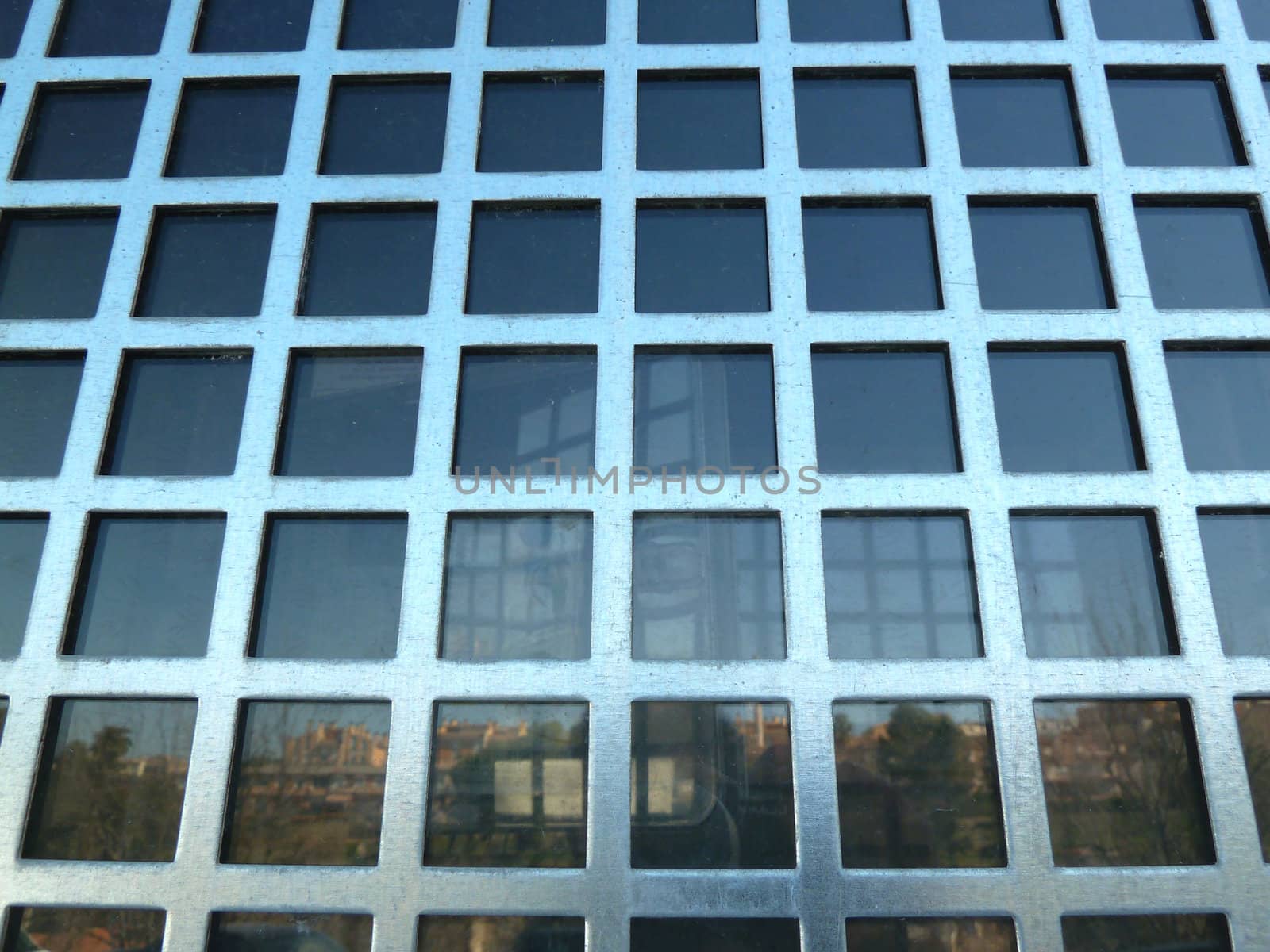reflection in glass with a metal grid
