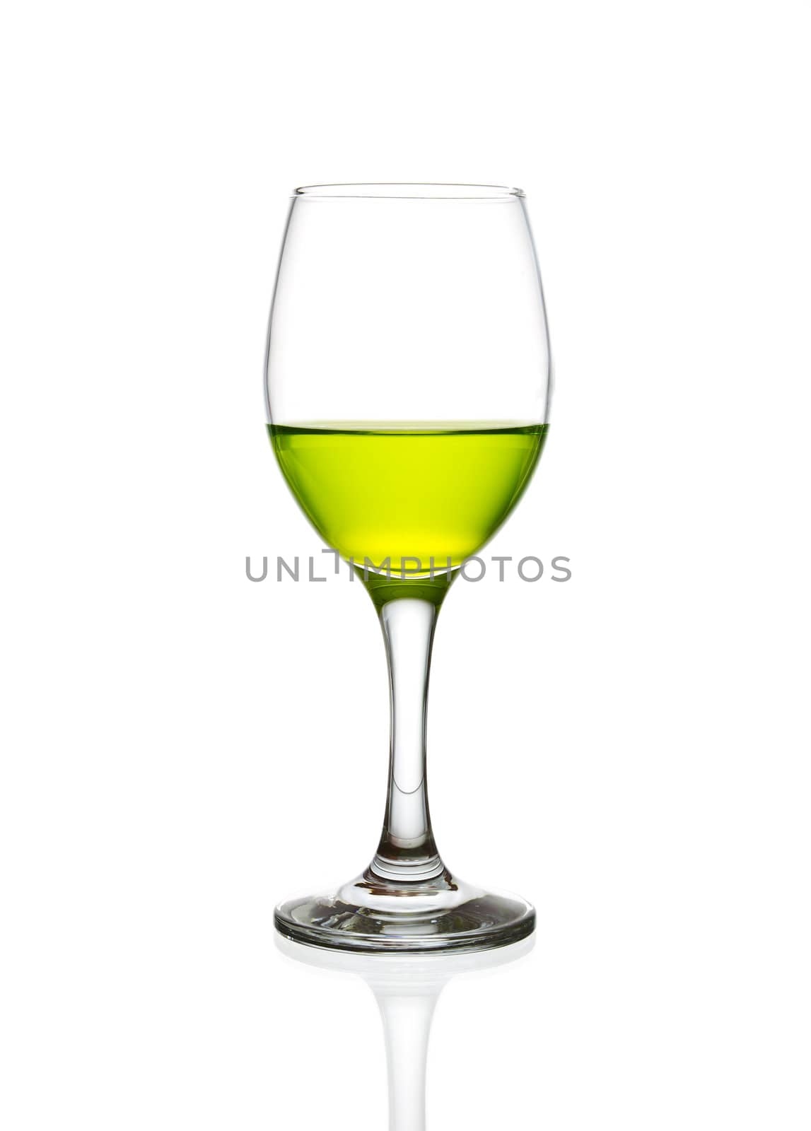 wine glass and green cocktail isolated