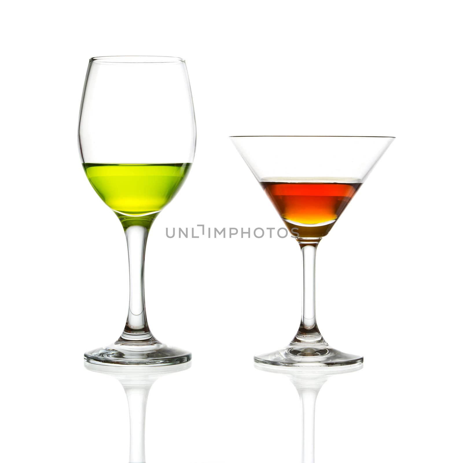 wine glass and green cocktail isolated