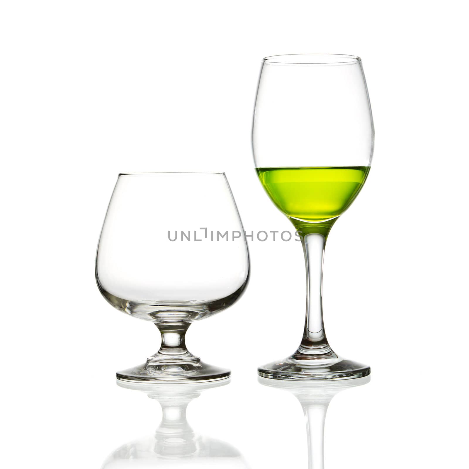 wine glass and green cocktail isolated