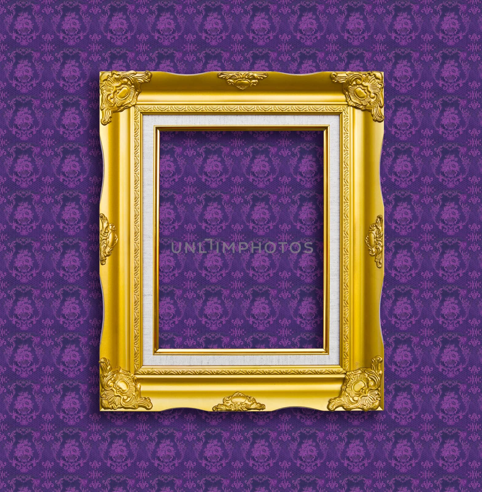 frame of golden wood  on purple wallpaper